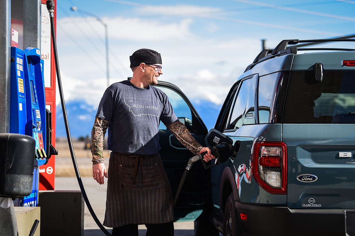 Roger Young fuels up his Ford Bronco at the White Oak Super Stop near Somers on his way to work on Thursday, March 17. (Casey Kreider/Daily Inter Lake)