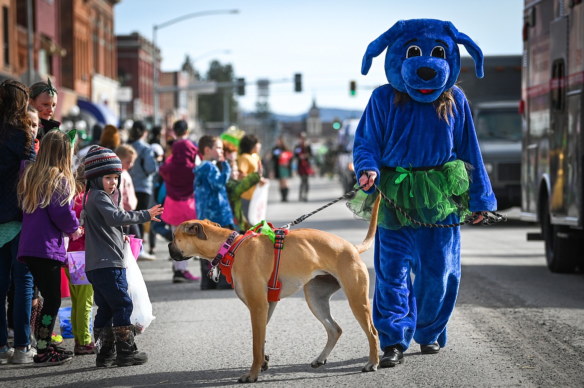 Parade participants walk along Main Street during the St. Patrick's Day Parade in Kalispell on Thursday, March 17. (Casey Kreider/Daily Inter Lake)