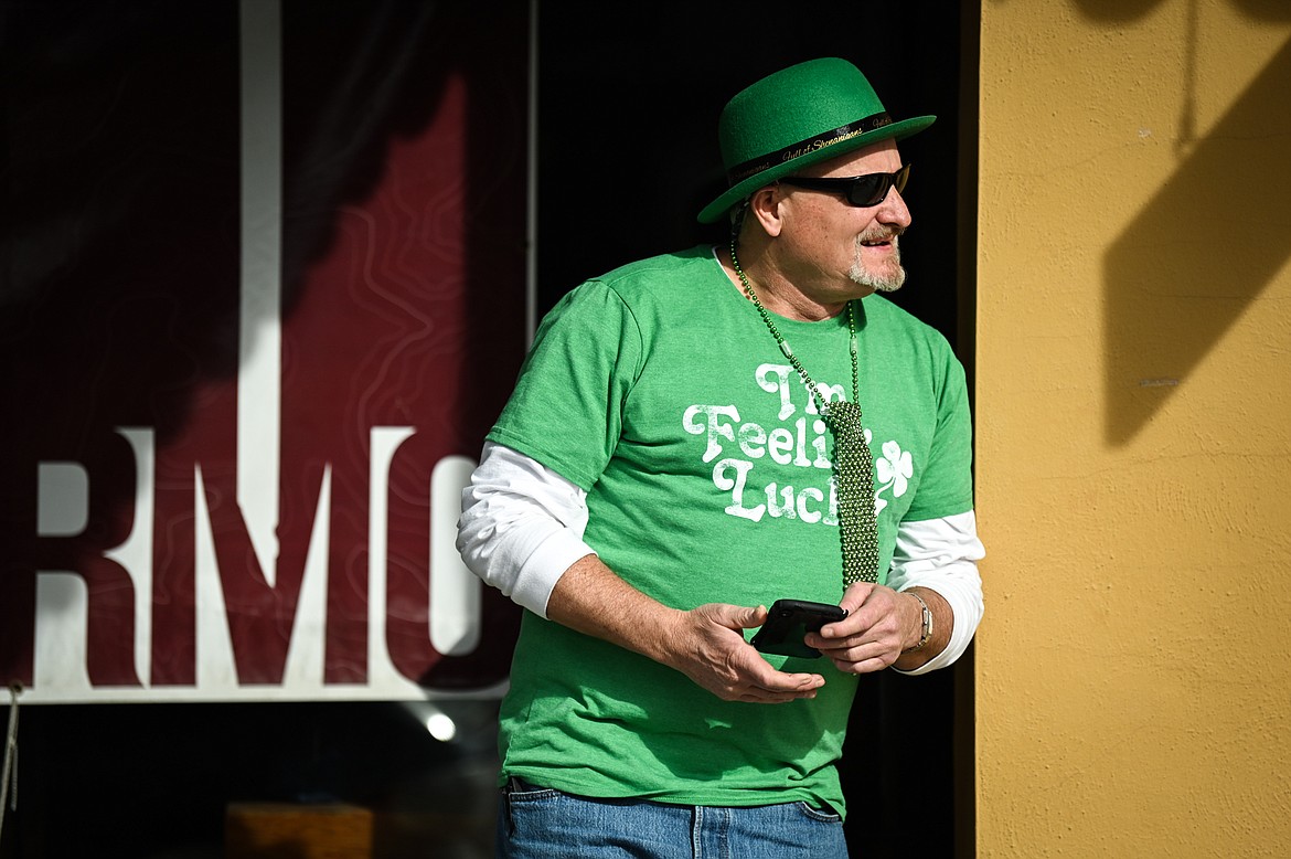 A spectator watches the St. Patrick's Day Parade in Kalispell on Thursday, March 17. (Casey Kreider/Daily Inter Lake)