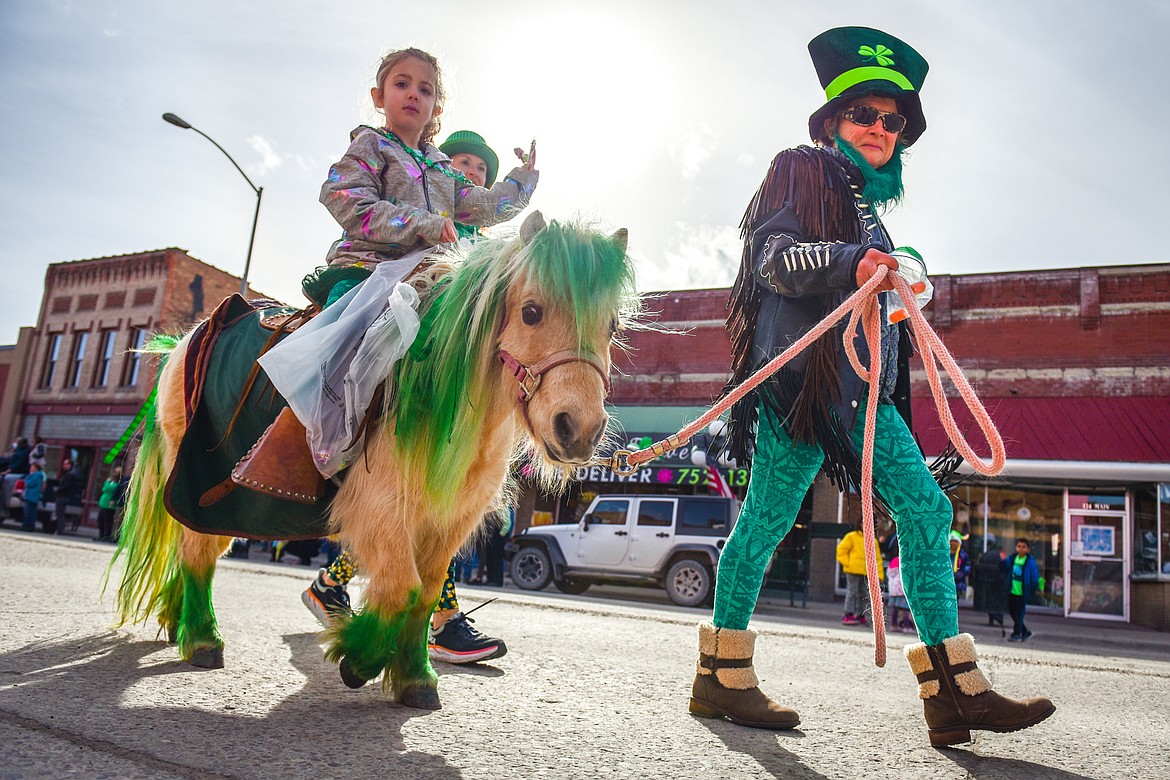 Parade participants walk along Main Street during the St. Patrick's Day Parade in Kalispell on Thursday, March 17. (Casey Kreider/Daily Inter Lake)