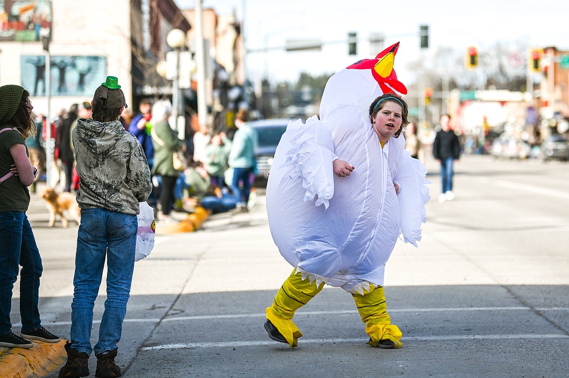 Ty Mckenzie takes a look down Main Street in anticipation of the St. Patrick's Day Parade in Kalispell on Thursday, March 17. (Casey Kreider/Daily Inter Lake)