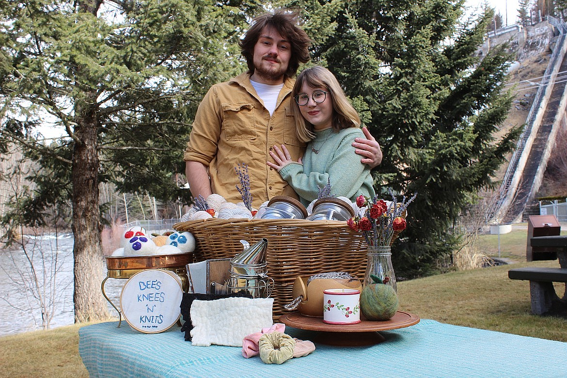 Kassie Dawn and Kyle Dean Cumming said they work together as a team, with both working to source materials and make the crafts. They sell salves, balms, soaps, wool dryer balls and sheets, candles, knitwear and more. (Taylor Inman/Bigfork Eagle)