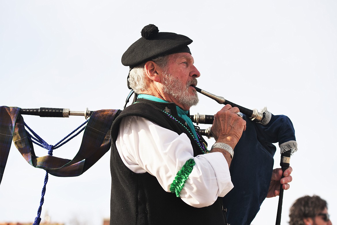 John Hamilton plays the bagpipes as he marches with the Great Scots Pipes and Drums Band. (Scot Heisel/Lake County Leader)