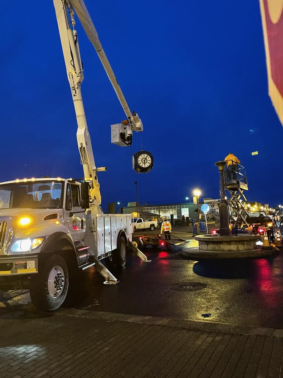 City crews disassembling the clock in the center of W. Third Avenue and Ash Street on Tuesday evening. The city hopes to have the landmark back in place before Easter.