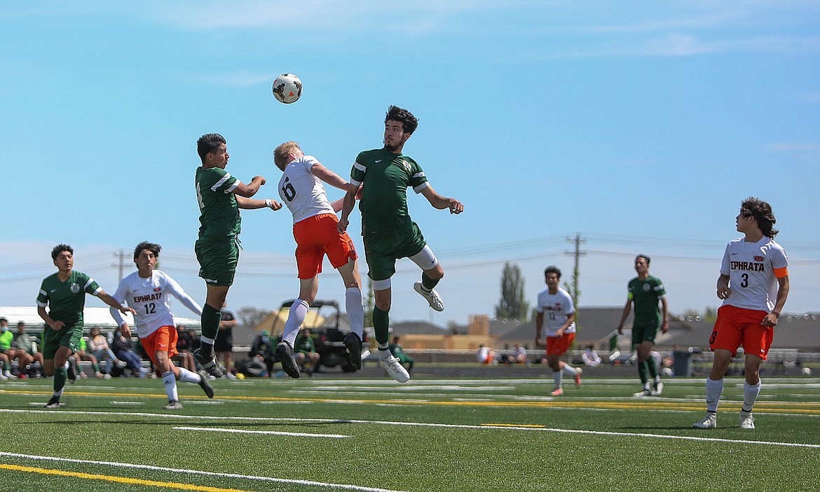 Ephrata's Hudson Sager (6) soars up for a header between a pair of Quincy players on May 1, 2021 at Quincy High School. This year, the Quincy boys are off to a great start with a 3-1 record so far.