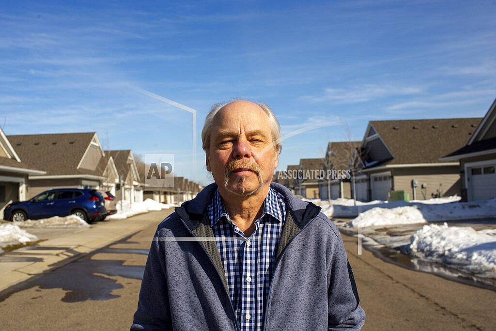 Jeffrey Carlson stands for a portrait outside his home in Vadnais Heights, Minn., on Sunday, March 13, 2022. Carlson, a Type 1 diabetic with heart stents, contracted COVID-19 in January, but recovered quickly after being treated with Merck's molnupiravir medication.