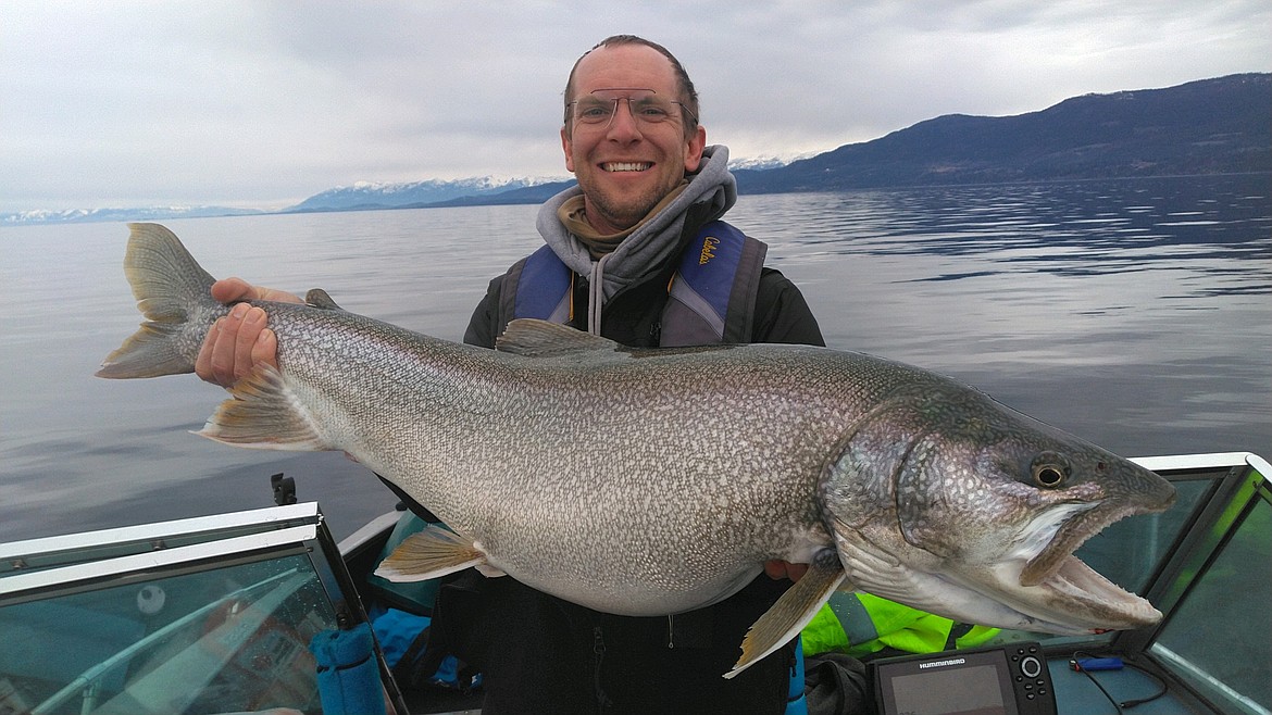 Spring Mack Days competitor Tristin Persico of Missoula holds a lake trout he caught that measured 38.25 inches and weighed in at 23 pounds.