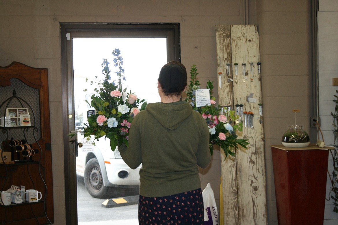 Tosh Spencer, Desert Rose Floral Designs in Othello, takes out floral arrangements for delivery. Owner Melody Anguiano said the success of Desert Rose is a team effort of family and staff.