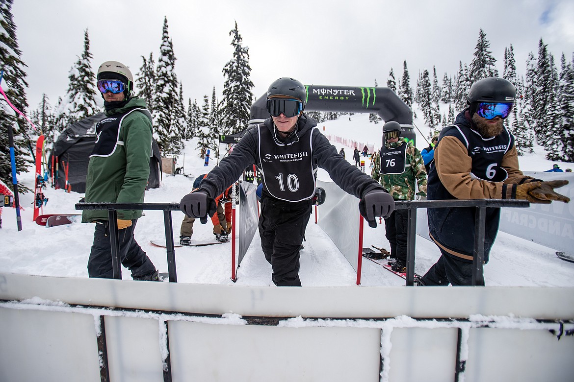 Racers pull off the metal bar to drop into the boardercross style course. (JP Edge photo)