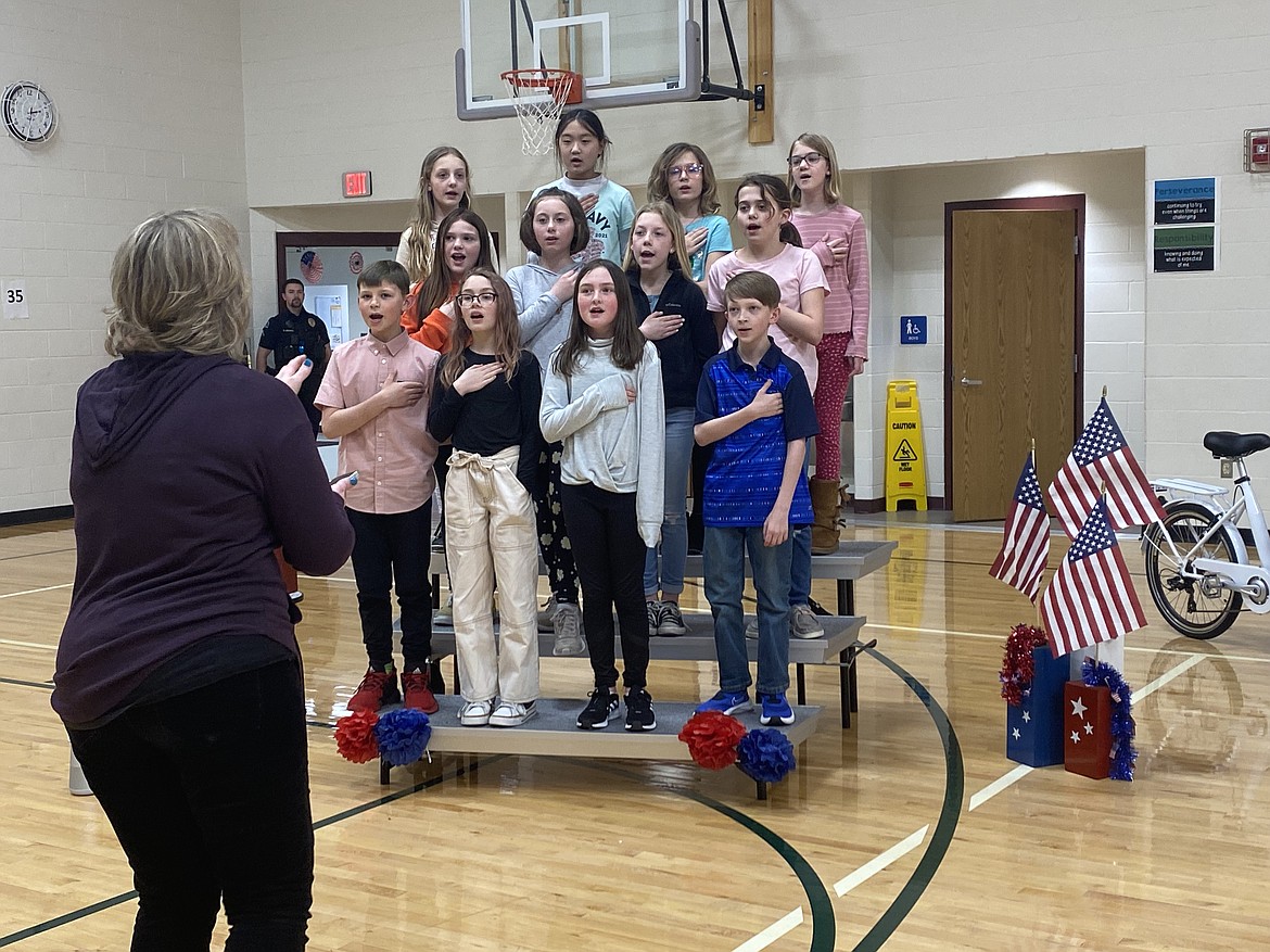 Members of the Greensferry Elementary Special Chorus entertained the crowd during the Operation Give Back ceremony, Tuesday. Back row from left: Daisy Hotaling, Kassi Sakamoto, Roslyn Vreeken, Ashley Schnabel. Middle row from left: Ellie Chamberlin, Braylee Collins, Lyla Hotaling, Emma Moses. Front row from left: Colton Koch, Ellie Geer, Kelyn Carpenter, Bentley Allen.