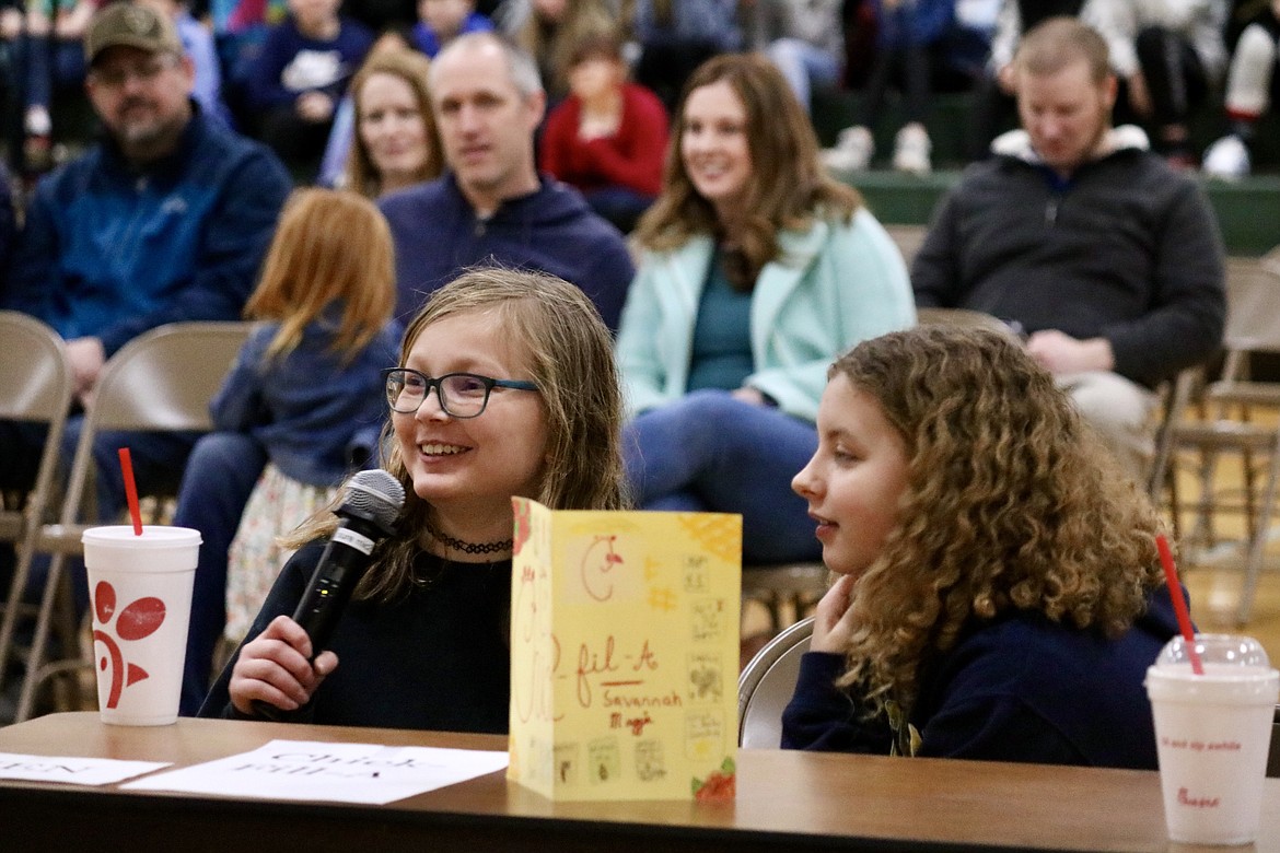 Fifth-grade finalist team, Savannah O'Hara and Magdalene Sobek, compete in the first Battle of the Books, a reading comprehension bowl, at Atlas Elementary School on Monday. HANNAH NEFF/Press