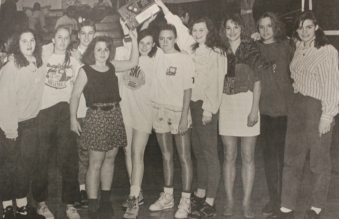 In the March 18, 1992 edition of the Bigfork Eagle: Victorious Vals show off their third place trophy at the western divisional tournament in Missoula. (left to right: Daphne Dennison, Soncerae Hastings, Shannon Searcy, Amy Knox, Wendy Best, Laura Sullivan, Della Conley, Angie Bork, Lisa Sullivan and Schuyler Baird. (Photo by Angie Garling)