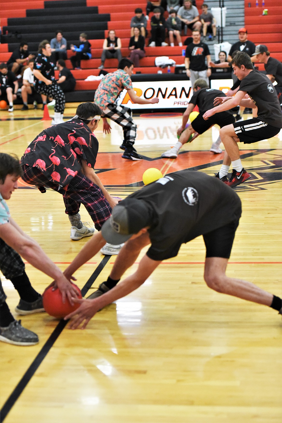 Two sides grab the dodgeballs to open a match. (Scot Heisel/Lake County Leader)