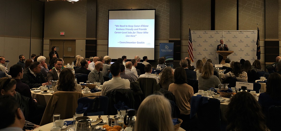 Statements from members of the Coeur d'Alene City Council flash on the big screen during Mayor Jim Hammond's presentation before the Coeur d'Alene Regional Chamber on Wednesday at The Coeur d'Alene Resort.