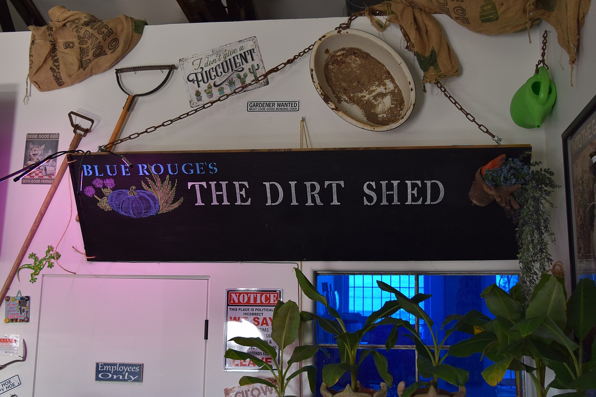 A sign for The Dirt Shed, where visitors to Blue Rouge Garden and Nursery can have coffee or beer and enjoy a game on a giant-screen TV. Owner Kimberly Ries Ashley said she felt the incorporated sports bar was a good way to accommodate those waiting on gardening hobbyists.