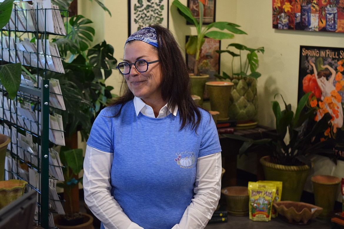 While she may not like having her picture taken, Kimberly Ries Ashely still smiles with a camera around when she’s in her new shop, Blue Rouge Garden and Nursery. Ashley says she enjoys the plants and the nurturing clientele that come into the place - a nice break from her other job as a domestic law attorney.