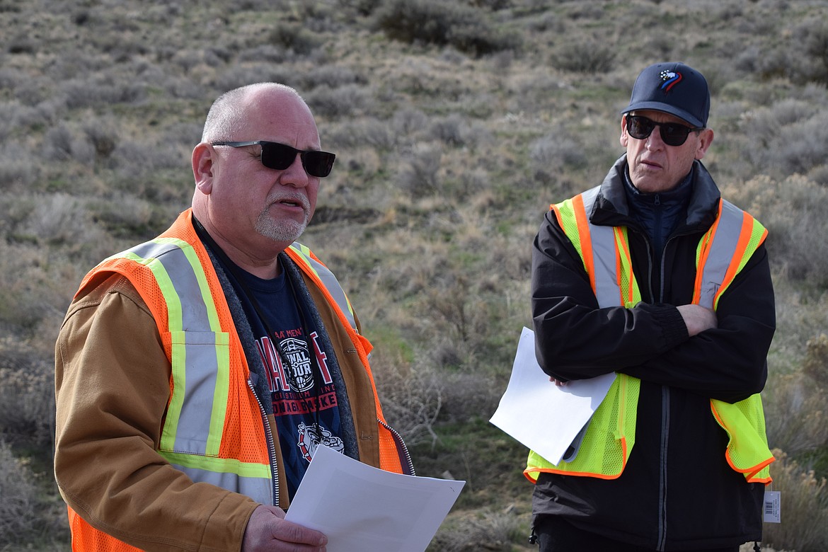 Grant County Public Works Director Sam Castro (left) and County Commissioner Danny Stone (right) during an impromptu public meeting to discuss repairs to Frenchman Hills Road on Thursday. A portion of the road was washed out when a canal operated by the Quincy Columbia Basin Irrigation District failed early last Friday.