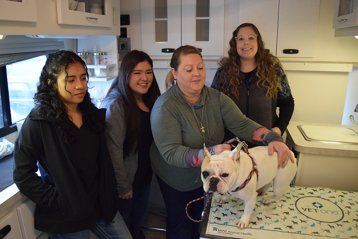 Veterinary assistants Jennifer Villanueva, Ashley Winn and Jessica Joslin and veterinarian Jeskya Morrison inside the operating room of Morrison’s mobile veterinary clinic.