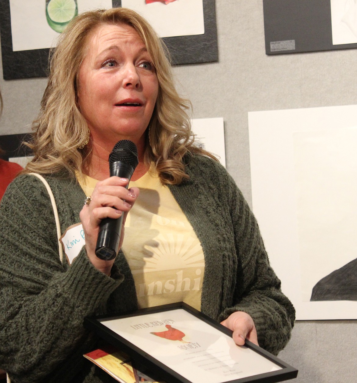 Kim Rose accepts the 2022 Little Red Hen award from the Bigfork Area Chamber of Commerce at the Bigfork Art and Cultural Center on March 10, 2022. (Taylor Inman/Bigfork Eagle)