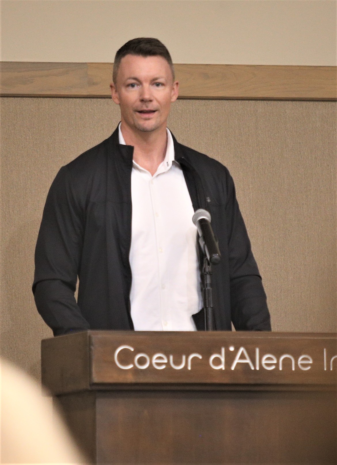 Nick Forsberg, owner of Atlas Building Group, speaks on Thursday during a meeting at the Best Western Plus Coeur d'Alene Inn. Forsberg was part of a panel of builders who spoke at the luncheon.