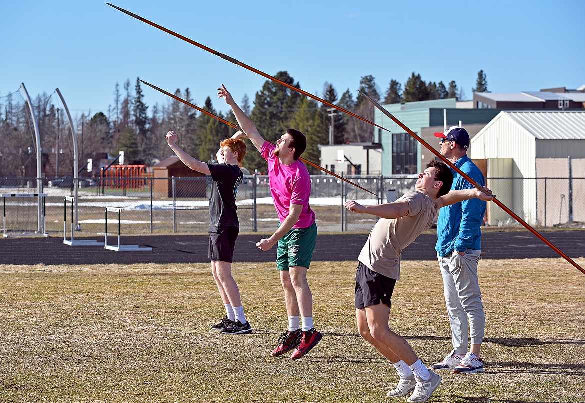 Whitefish High School track and field athletes (left to right) Ian Finley, Kitar Olson and Dennis Shestak practice javelin throwing last week. (Whitney England/Whitefish Pilot)