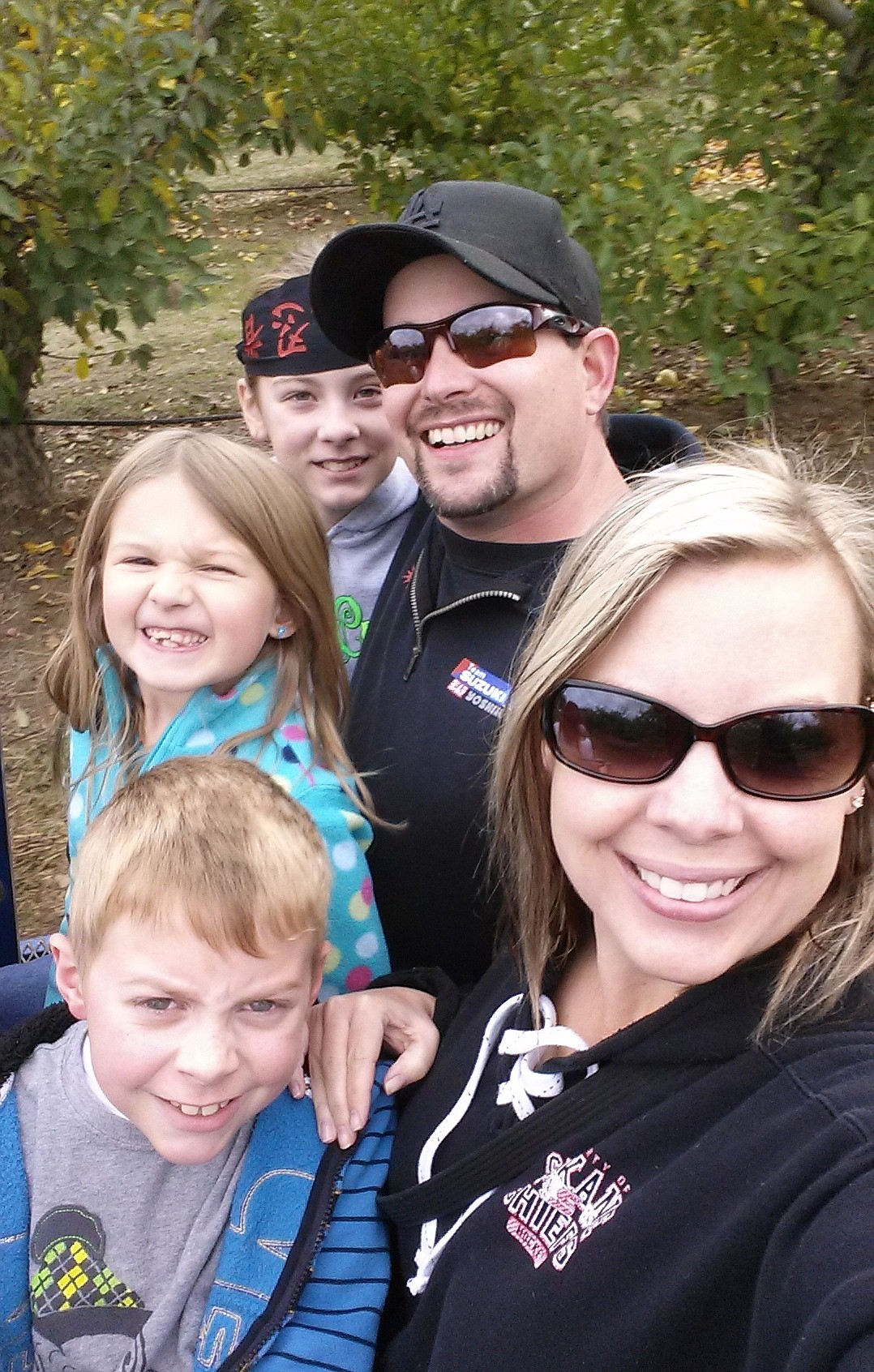 Eric and Megan Ellis with children Carley, Ava and Carter. The blended family picked apples together in Otis Orchards, Wash. in 2017. Courtesy photo.