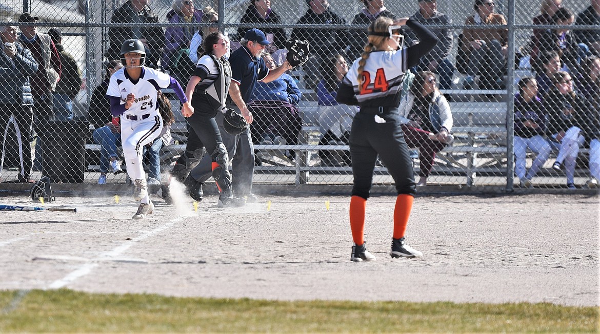 Turquoise Pierre runs toward first base on a triple against Plains-Hot Springs. (Scot Heisel/Lake County Leader)