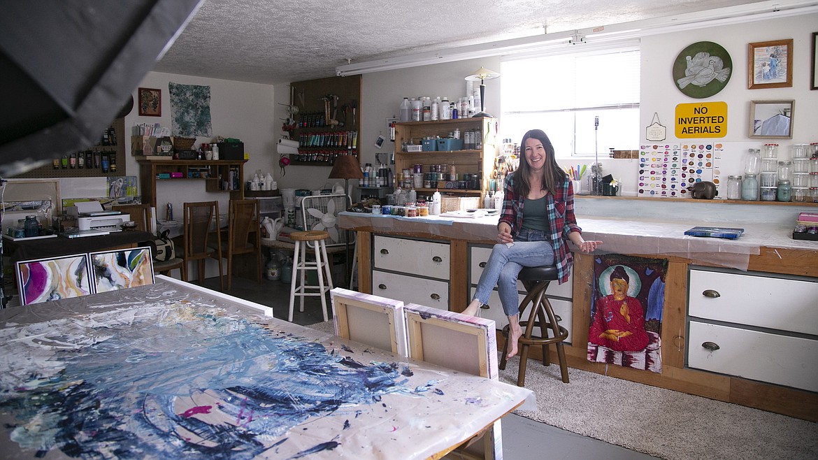 Sara Taylor sits barefoot in her home studio where she creates fluid art pieces. On top of a popular YouTube channel, Taylor mentors younger artists, provides workshops, and accepts commission requests.