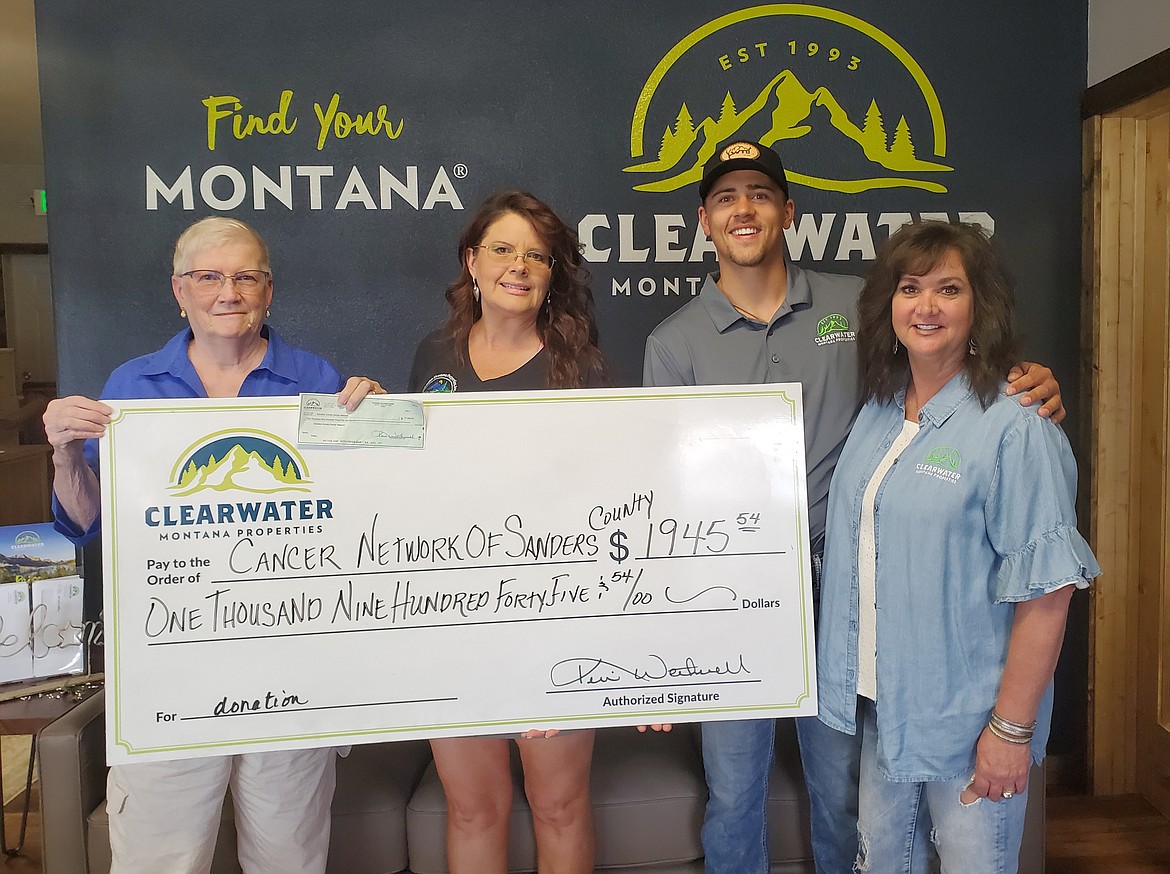 The 2021 donation to Cancer Network of Sanders County for $1,945, left to right, Kathy Miller with CNSC, Mary Halling, Bransen Krebs and Dawn Krebs with Clearwater Mt. Properties.