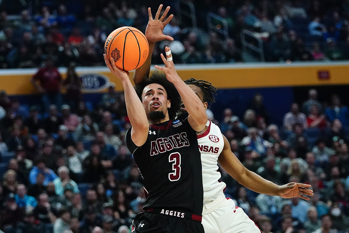 FRANK FRANKLIN II/Associated Press
New Mexico State guard Nate Pryor (3), who played as a freshman and sophomore at North Idaho College, shoots against Arkansas guard JD Notae during the second half of a second round in the NCAA basketball tournament on March 19 in Buffalo, N.Y.