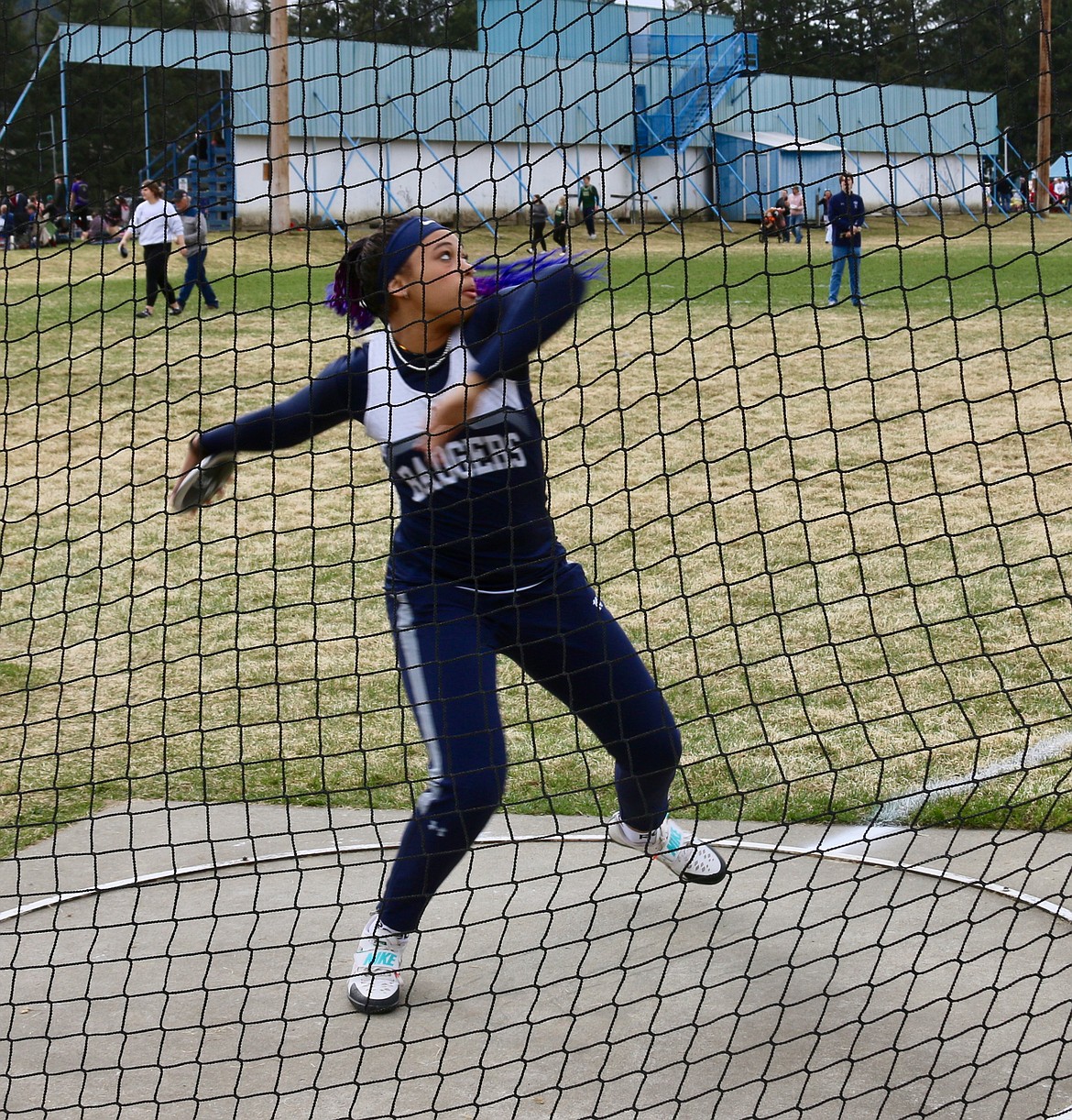 Asha Abubakari throwing the discus at the Bonners Ferry Invite March 26. Abubakari won three of her events and took second in discus.