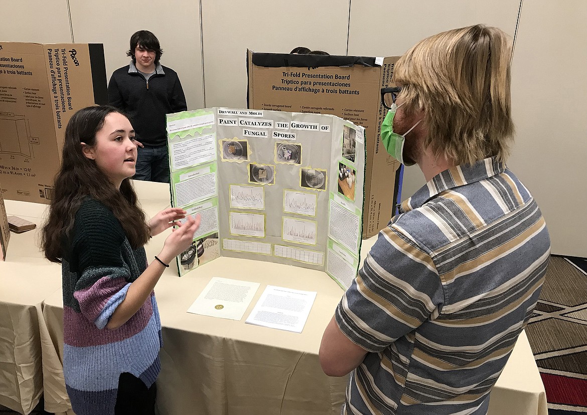 Post Falls High School sophomore Kaitlyn Carmack discusses her research project at the sixth annual Northern Idaho Science and Engineering Fair in the Coeur d'Alene Resort on March 11. Kaitlyn earned Best in Category in Animal, Biomedical and Microbiological Sciences.