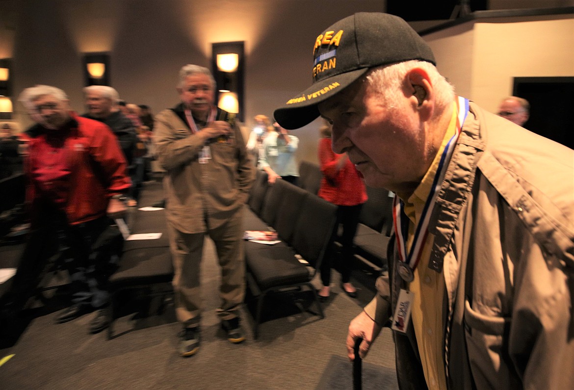 Veteran Al Holm enters the sanctuary at Candlelight Christian Fellowship when Vietnam War veterans were introduced on Tuesday.