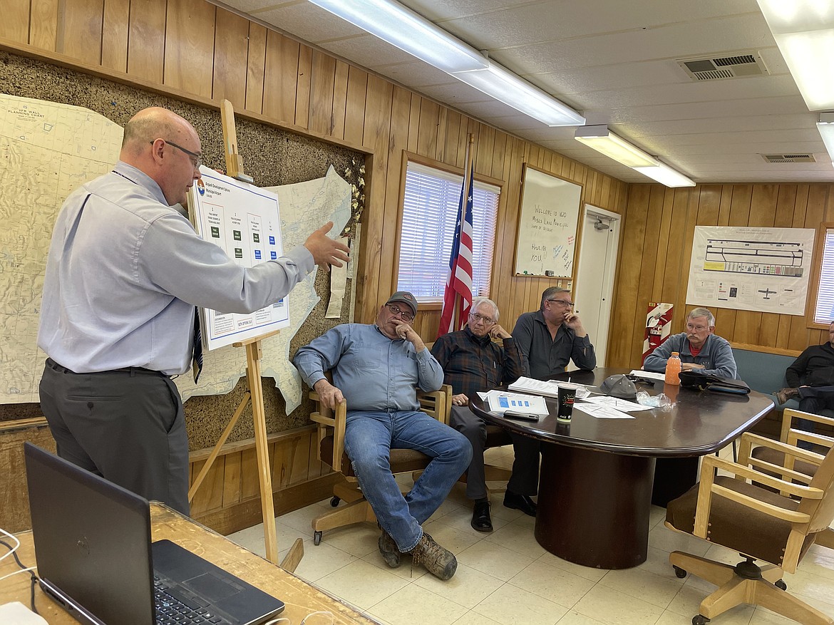 City of Moses Lake Municipal Services Director David Bren (left) outlines one possible development plan for the Moses Lake Municipal Airport to Airport Advisory Board members Tim Prickett, Richard Pearce, Darrin Jackson and Finley Grant during a regular meeting of the advisory board at the airport on Tuesday.