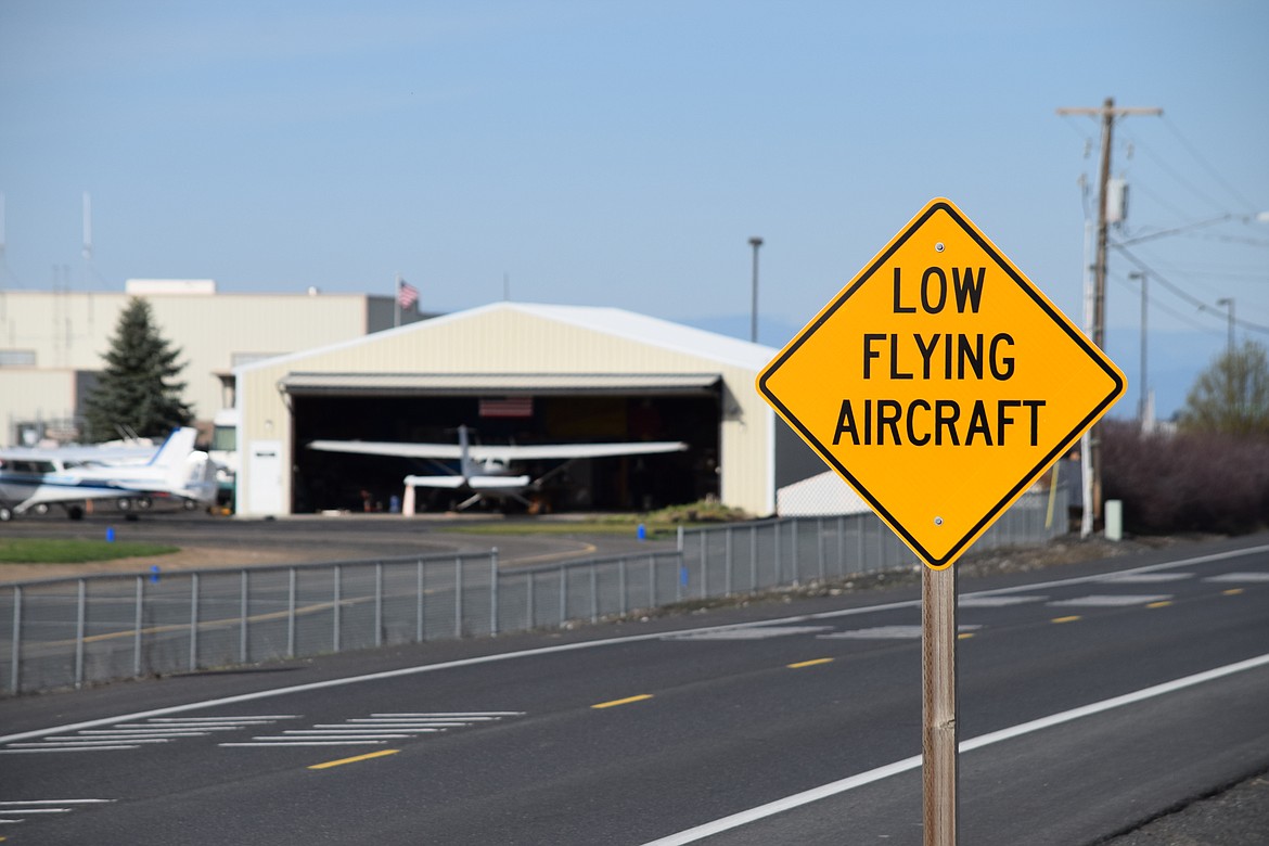 This sign on Road 4 Northeast near the intersection with Road L Northeast warnsg of the approach of aircraft landing and taking off from the Moses Lake Municipal Airport, located on the northeast side of town.