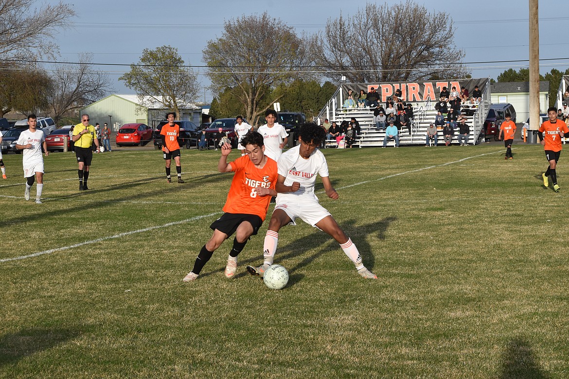 Ephrata High School sophomore Jorge Rodriguez (8) collides with an East Valley player as they fight for possession of the ball during the matchup at Ephrata High School on March 29.