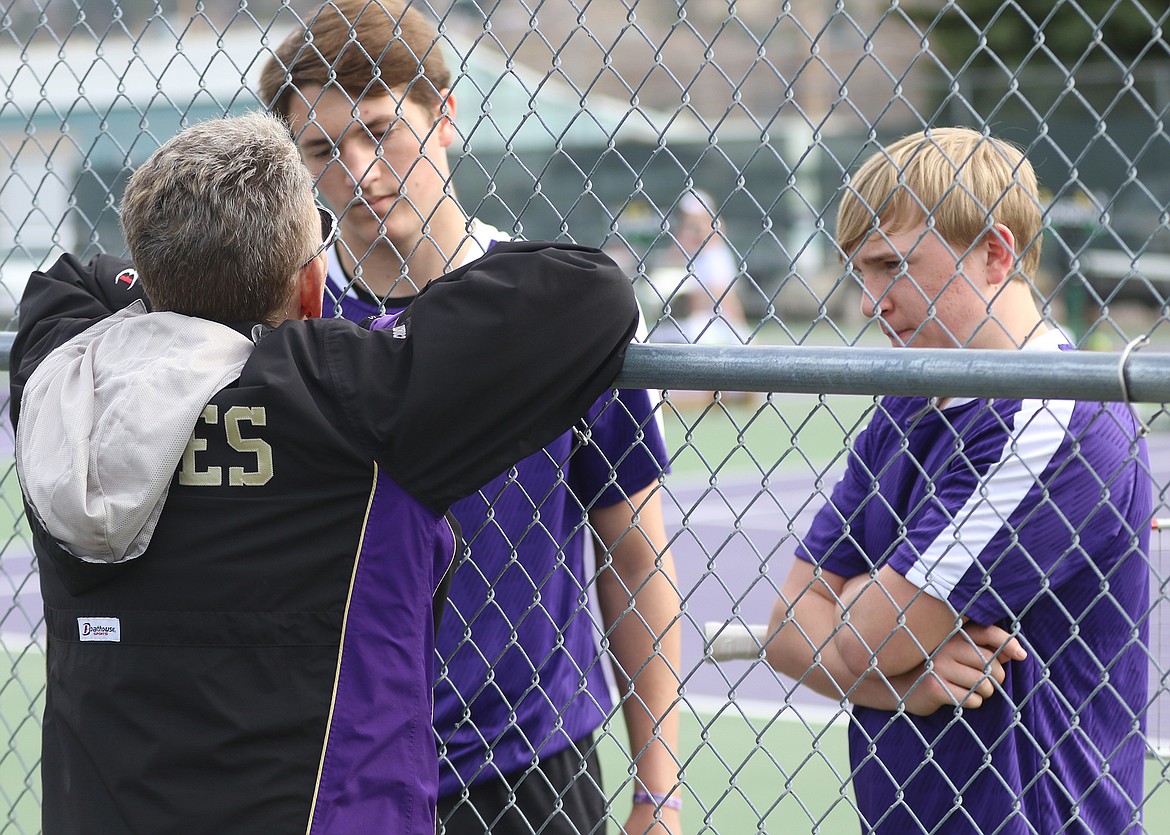 Assistant coach Donna Hislop talks with Owen McElwee, left, and Colter Wilson. (Courtesy of Bob Gunderson)