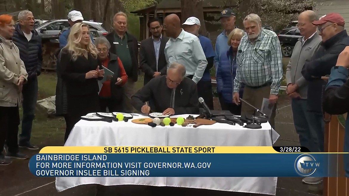 Gov. Inslee took a minute after signing Senate Bill 5615 to extend his seal of approval to community members' pickleball gear.