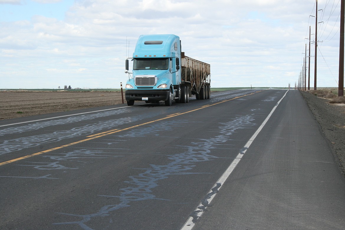 A truck travels Booker Road near Othello. A section of the road is scheduled for refurbishment this summer.