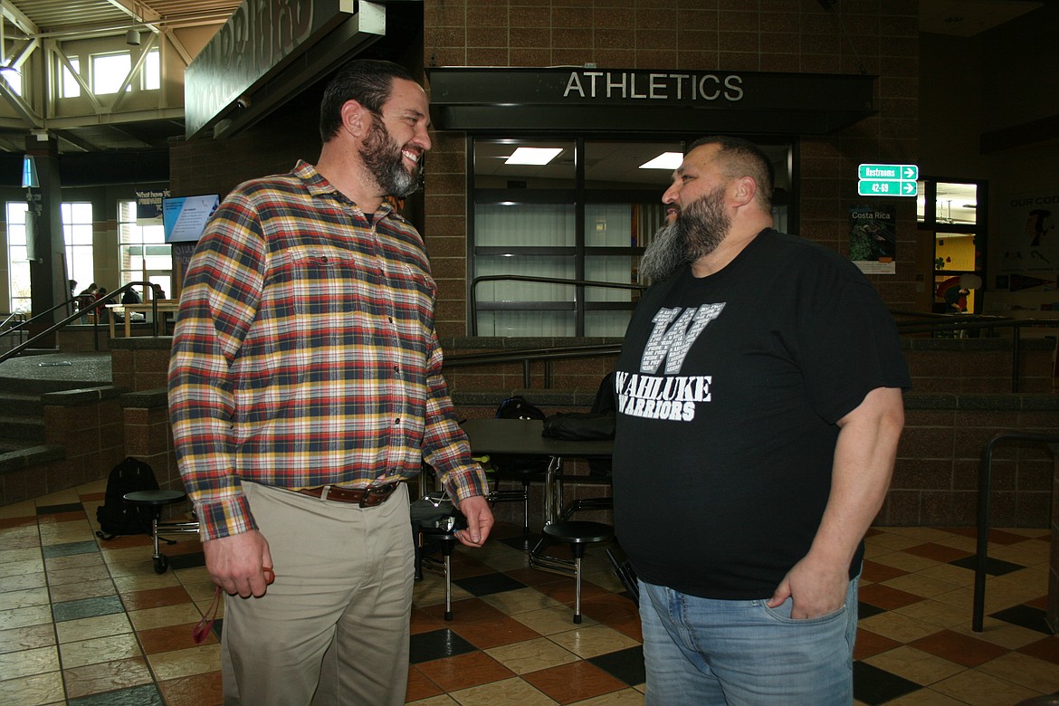 JJ Calzadillas (right), safety and security coordinator for the Wahluke School District talks with Wahluke High School principal Cody Marlow (left).