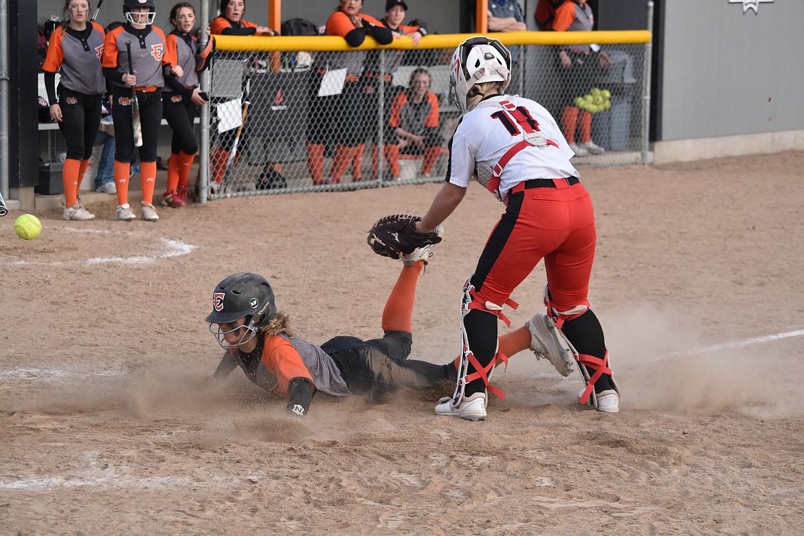 Ephrata High School freshman Kaydence Hector slides into home base, and called safe, during the doubleheader against East Valley on March 29 at Ephrata.