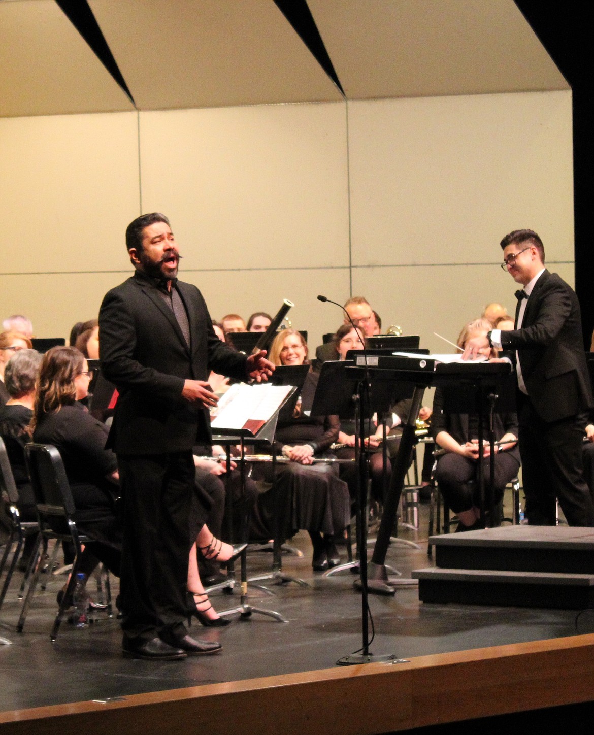 North Idaho College professor of music and choir director Max Mendez sings baritone for a rendition of classic folk tune "Shenandoah" during the NIC Wind Symphony concert March 23.