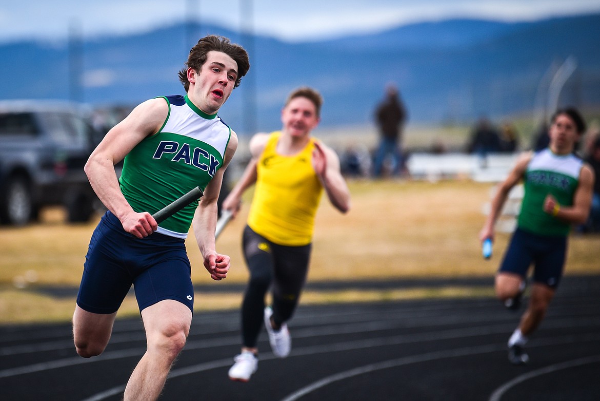 Glacier's Jake Turner runs in the boys 400 meter relay in a dual against Helena Capital at Glacier High School on Friday, April 1. The team consists of Turner, Xavier Stout, Jackson Hensley and Connor Sullivan. (Casey Kreider/Daily Inter Lake)