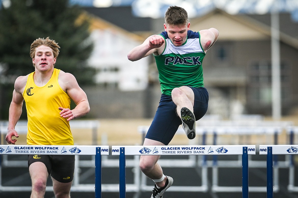 Glacier's Caleb Bernhardt clears a hurdle in the boys 300 meter hurdles in a dual against Helena Capital at Glacier High School on Friday, April 1. (Casey Kreider/Daily Inter Lake)