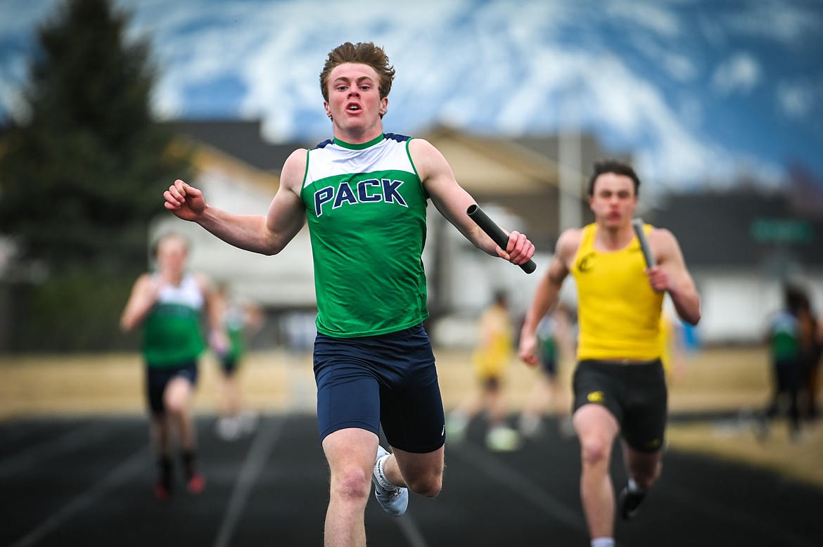 Glacier's Xavier Stout crosses the finish line in the boys 400 meter relay in a dual against Helena Capital at Glacier High School on Friday, April 1. Stout anchors the team which consists of Jake Turner, Jackson Hensley and Connor Sullivan. (Casey Kreider/Daily Inter Lake)