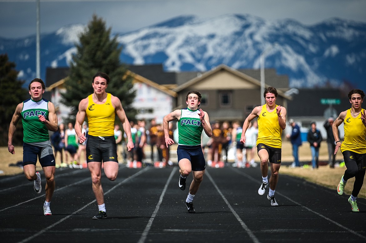 Glacier sprinters Jackson Hensley, left, and Jake Turner run the 100 meter dash in a dual with Helena Capital at Glacier High School on Friday, April 1. (Casey Kreider/Daily Inter Lake)