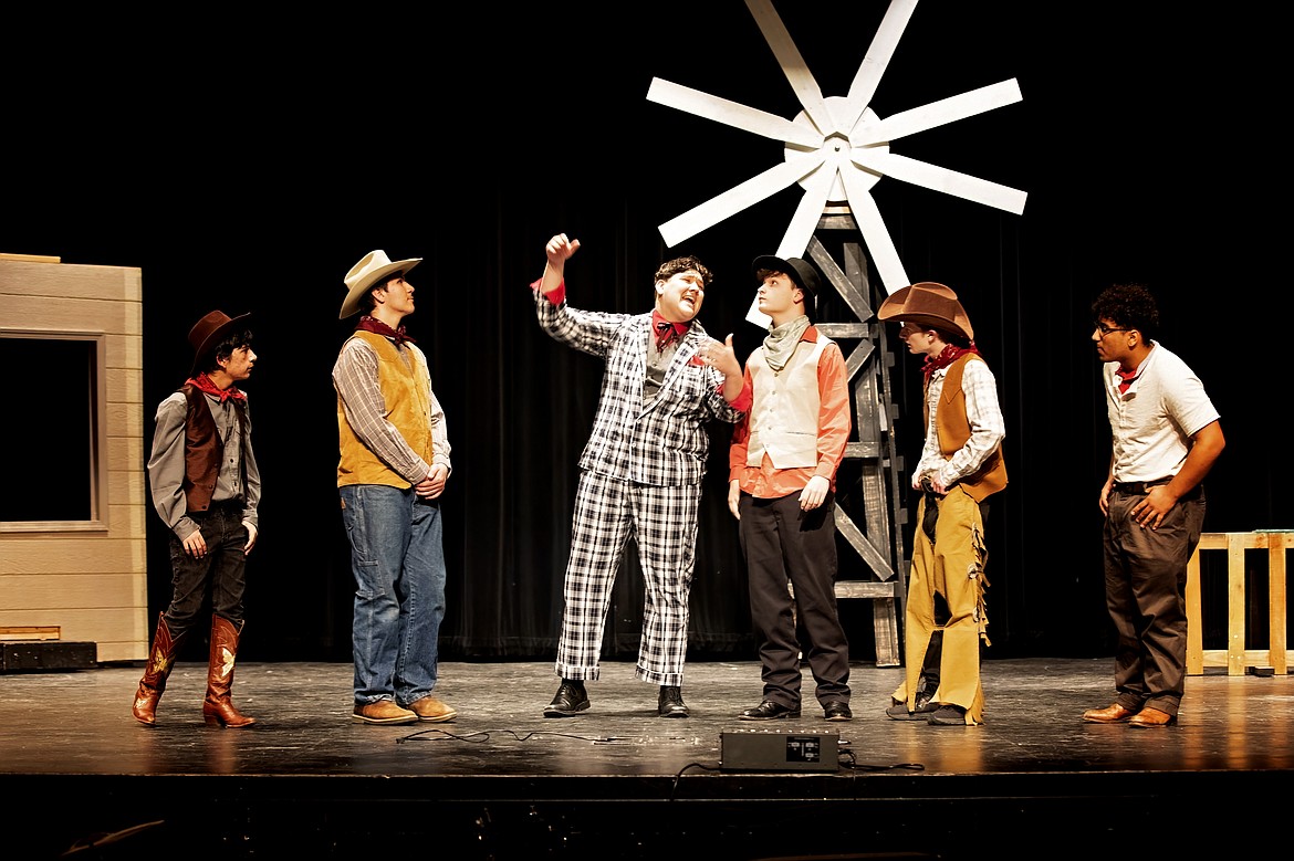 The cowboys hear a tall tale in the production of “Oklahoma!” by Moses Lake High School Drama. After two years of pandemic-related frustrations, students are excited to be back on stage.