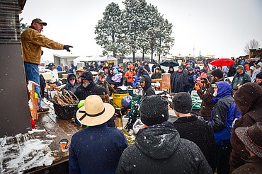 An auctioneer takes bids on merchandise at the 56th annual Creston Auction on Saturday, April 2. The Creston Auction and Country Fair is the largest annual fundraiser for the all-volunteer Creston Fire Department and has been held in Creston since 1966. (Casey Kreider/Daily Inter Lake)