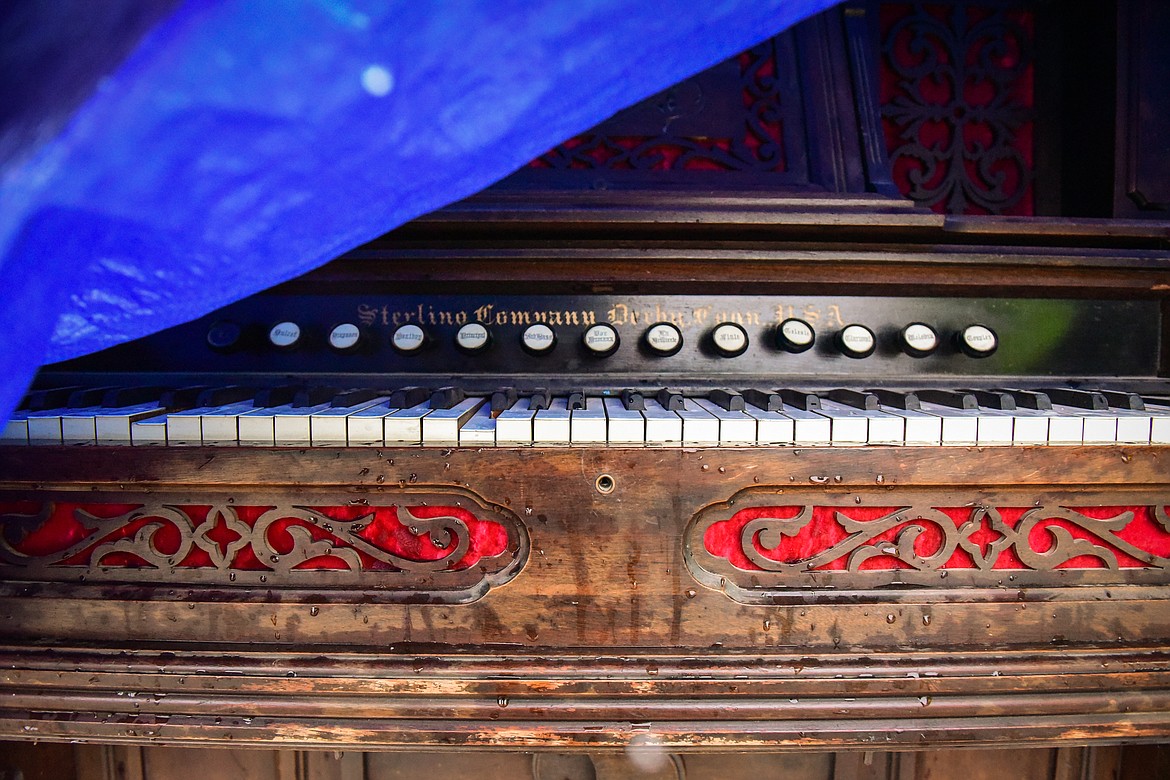 A pump organ is shielded from the rain and snow by a tarp at the 56th annual Creston Auction on Saturday, April 2. The Creston Auction and Country Fair is the largest annual fundraiser for the all-volunteer Creston Fire Department and has been held in Creston since 1966. (Casey Kreider/Daily Inter Lake)