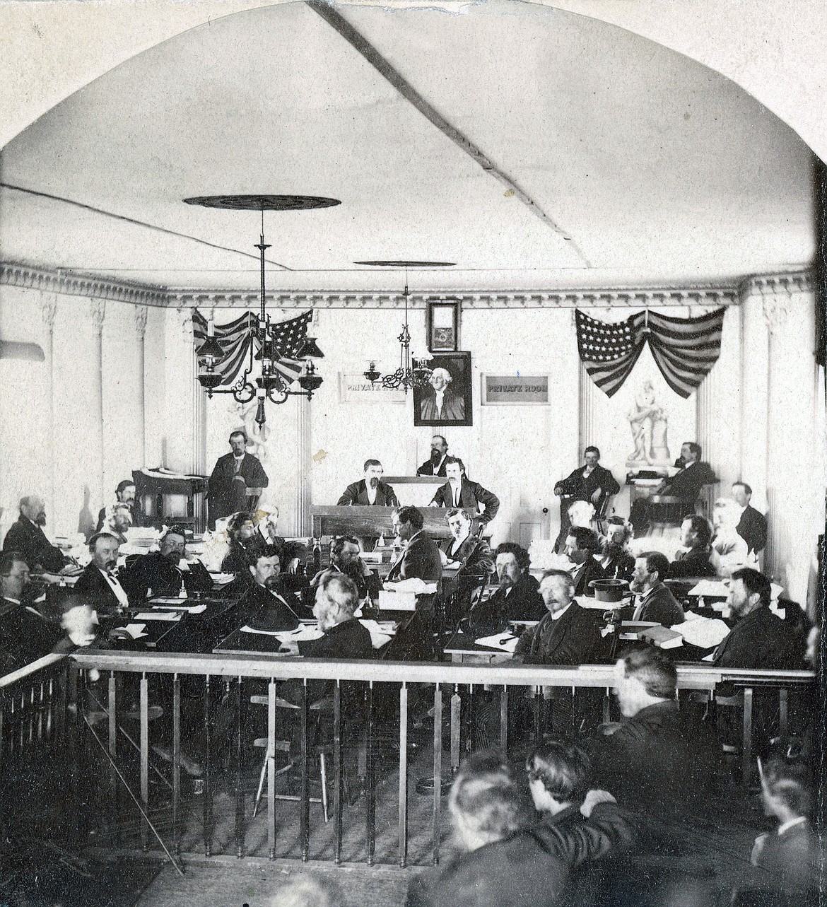 This historical image provided by Montana Historical Society Research Center shows a photo reproduced from an 1874 stereograph shows the 8th Legislative Assembly in Stonewall Hall in Virginia City, Montana Territory. An effort is underway to save the preserve the capitol building. (Montana Historical Society Research Center via AP)